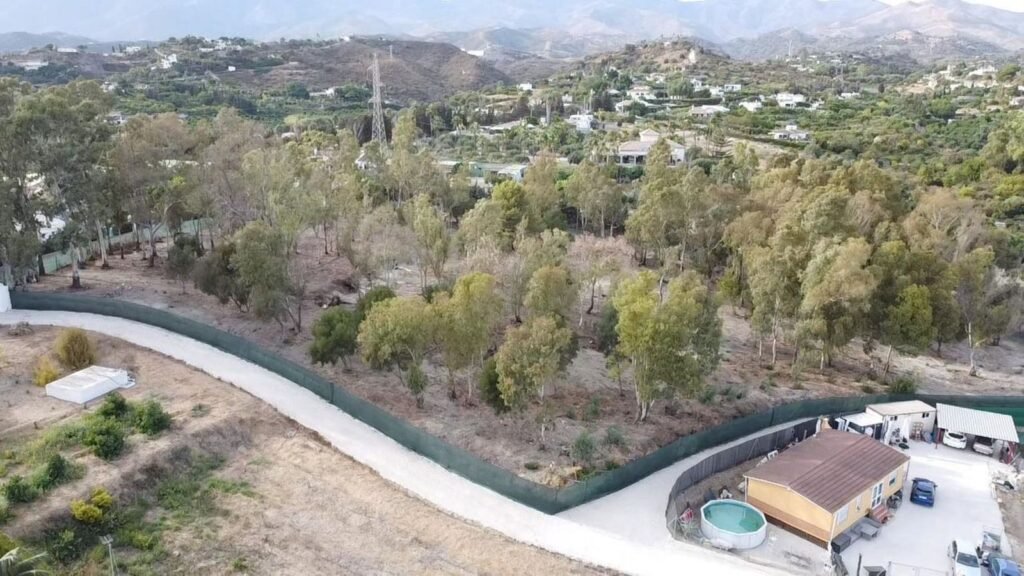 Land for Sale in Estepona – Fenced 10,000m² Plot with Log House