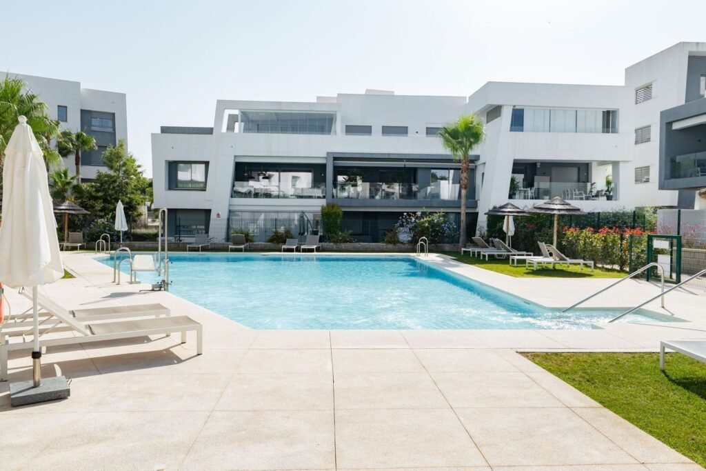 2 Bed Top Floor Apartment for Sale in Estepona – Pools, Gym & Garden Views